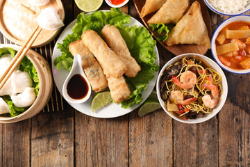 assorted of asian food with spring roll, soup, shrimp, rice