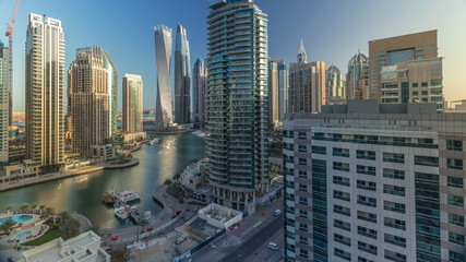 Obraz premium Aerial view of Dubai Marina residential and office skyscrapers with waterfront timelapse