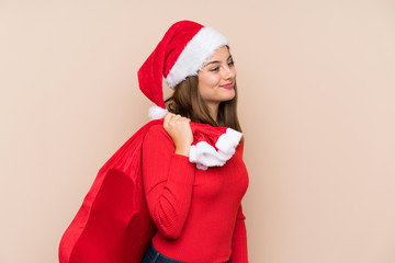 Young girl with christmas hat over isolated background