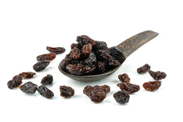 Black sweet Raisins or dried sweet grapes (kali kishmish or Zante currant) isolated on white background