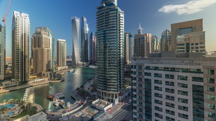 Aerial view of Dubai Marina residential and office skyscrapers with waterfront timelapse