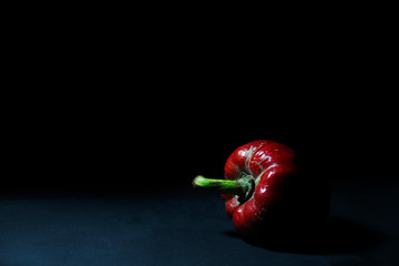 red chili pepper on black background