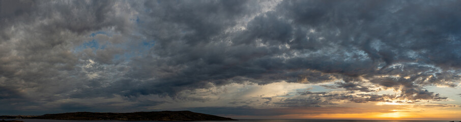 Sunset panorama over sea Beautiful cloudscape over the sea, sunrise / sunrise
