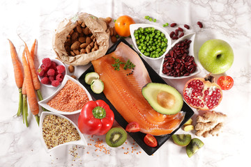health food selection- top view- carrot, fish,avocado, cereal and fruit