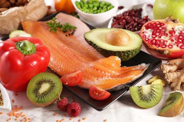 health food selection- carrot, fish,avocado, cereal and fruit