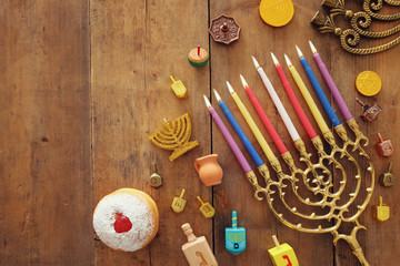 religion image of jewish holiday Hanukkah background with menorah (traditional candelabra), spinning top and doughnut