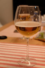 Close up of wineglass with white wine on table