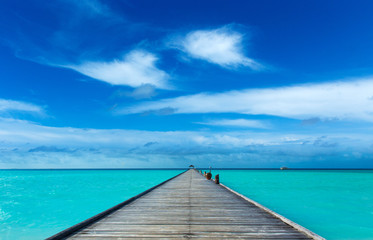  Maldives sea. tropical Maldives sea against blue cloudy sky