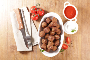 fried meatball with tomato sauce