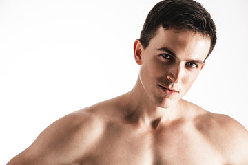 Portrait of handsome young man posing over white background. Perfect hair & skin. Close up. Studio shot