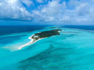 Fototapeta na wymiar aerial view of Maldives and tropical beach . Travel and vacation concept