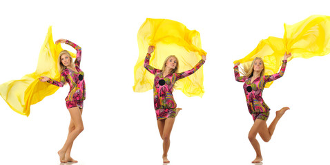 Three isolated young blond beautiful women models in pink dress with oriental pattern dancing with yellow silk cloth over white background in photo studio. Beauty and fashion lifestyle concept