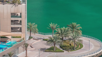 Waterfront promenade in Dubai Marina aerial timelapse. Dubai, United Arab Emirates