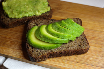 Avocado toast on the rye bread. Healthy food concept.