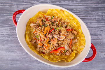 Rice with seafood on wax, served in Kazan