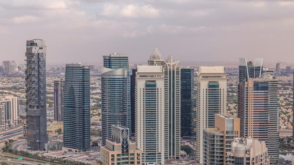 Fototapeta na wymiar Dubai Marina skyscrapers and jumeirah lake towers view from the top aerial timelapse in the United Arab Emirates.