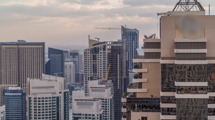 Dubai Marina skyscrapers and jumeirah lake towers view from the top aerial timelapse in the United Arab Emirates.