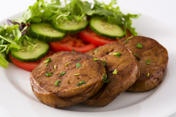 Seitan with vegetables isolated on white background. Fake meat.