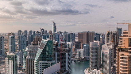 Fototapeta na wymiar Dubai Marina skyscrapers and jumeirah lake towers view from the top aerial timelapse in the United Arab Emirates.