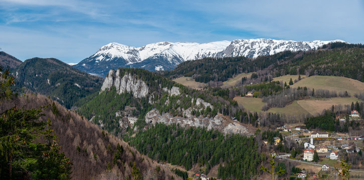 Viaduct and tunnel on the Semmering Railway with the Rax mountain range in the background. The Semmering Railway is the oldest mountain railway of Europe and a Unesco World Heritage site.