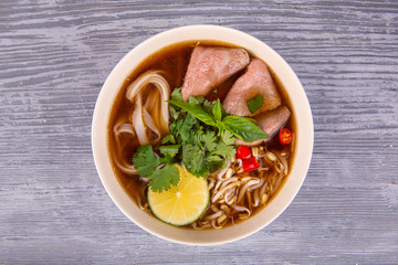 Soup with vermichel, noodles and pieces of meat