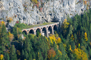 Viaduct and tunnel on the Semmering Railway. The Semmering Railway is the oldest mountain railway...