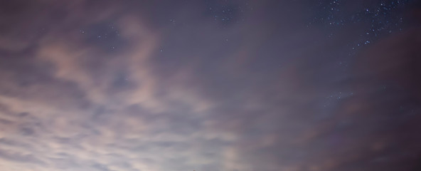 Starry sky and clouds. Night photography. Astronomical background.