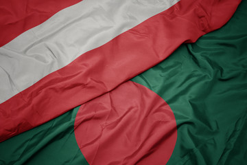 waving colorful flag of bangladesh and national flag of austria.