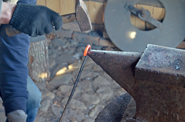 The work of a blacksmith. Creating a horseshoe in the old tradition