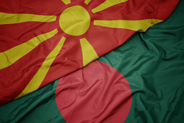 waving colorful flag of bangladesh and national flag of macedonia.