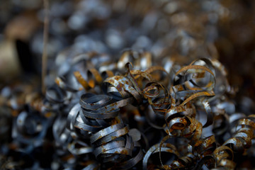 Pile of scrap metal. Rusty metal pipes and fillings. Materials for recycling from manufacturing process.