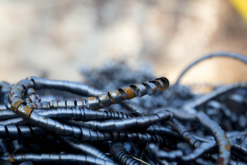 Pile of scrap metal. Rusty metal pipes and fillings. Materials for recycling from manufacturing process.