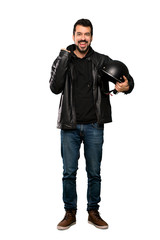 Naklejka premium Full-length shot of Biker man celebrating a victory in winner position over isolated white background