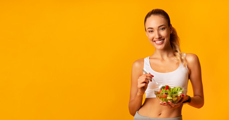 Fit Girl Eating Veggie Salad Standing Over Yellow Background, Panorama