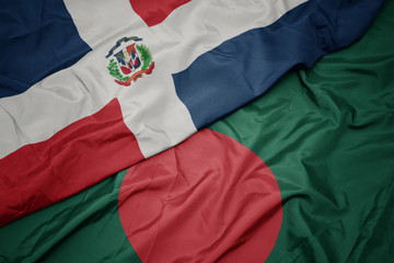waving colorful flag of bangladesh and national flag of dominican republic.