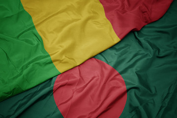 waving colorful flag of bangladesh and national flag of mali.