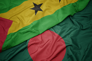 waving colorful flag of bangladesh and national flag of sao tome and principe .
