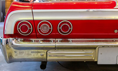 Classical American Vintage car 60s. Back view.