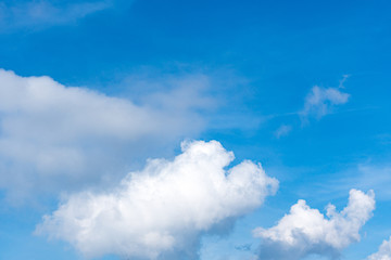 Naklejka na ściany i meble Blue sky background with clouds, copy space for text.