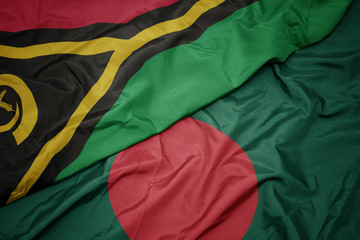 waving colorful flag of bangladesh and national flag of Vanuatu .