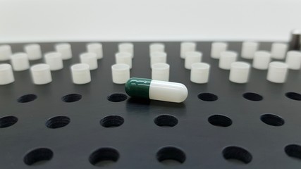 Green capsules machine in a pharmacy prescription