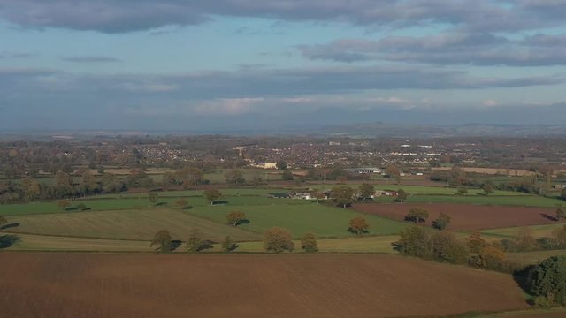 Telephoto aerial view of Moreton-In-Marsh, autumnal landscape of the Cotswolds.