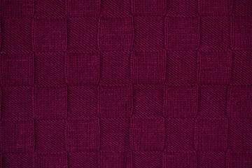 Purple plaid knitted. Texture of knitted fabric.