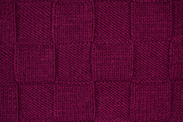 Fototapeta premium Purple plaid knitted. Texture of knitted fabric.
