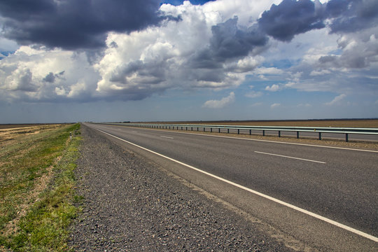 Modern highway against a spring sky in Kyzylorda Oblast of Kazakhstan