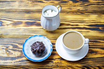 coffee with milk with cookies on a wooden background, top view