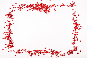 Pomegranate seeds isolated on white.