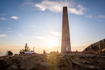 Parson Russell Terrier on a mountain top during sunset