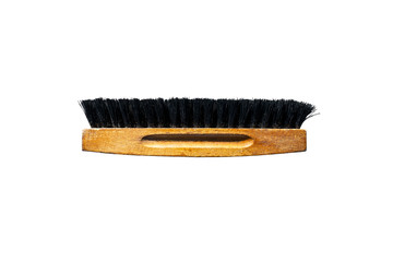 Brush for polishing shoes with black bristles, isolated on a white background with a clipping path.