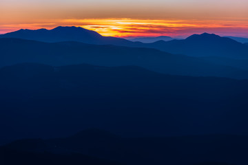 Beautiful sunrise in the mountains with a silhouette of the mountains
